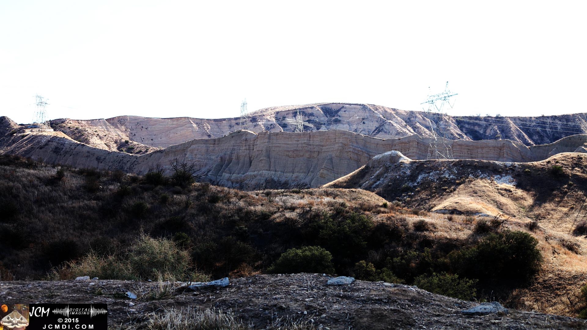 Landslide, buckled pavement, and terrain at Vasquez Canyon Road in Santa Clarita, CA filmed 11-25-2015